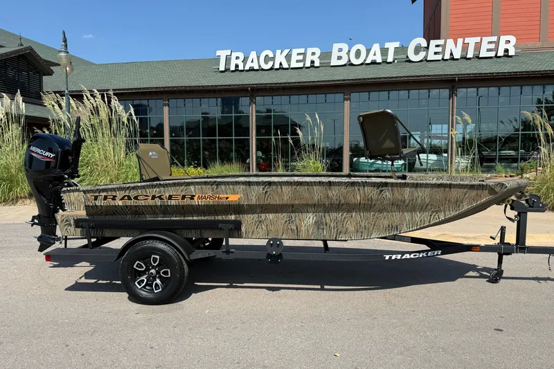 Slide: The Image of 2026 Tracker Grizzly 1756 T Marsh boat at Tracker Boat Center, featuring camouflage design. - 5