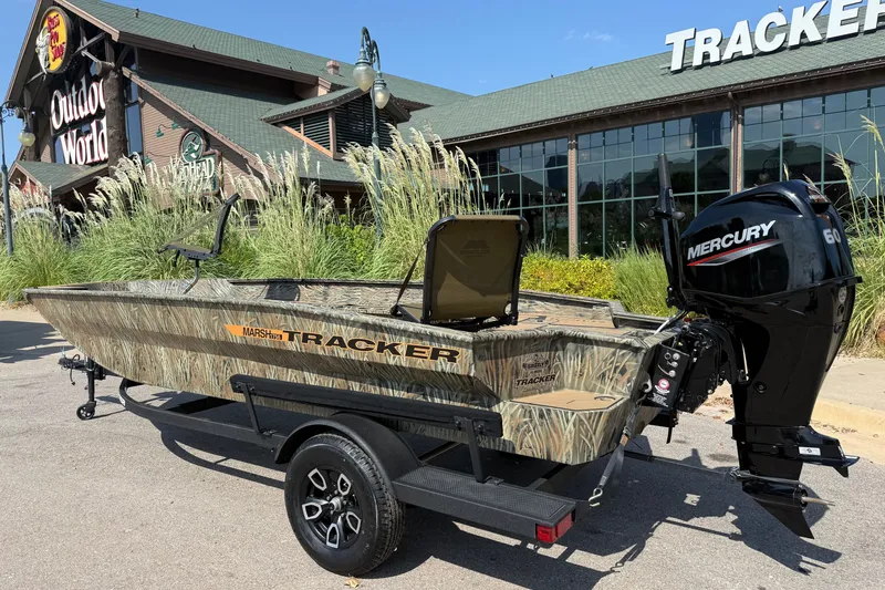 Slide: The Image of 2026 Tracker Grizzly 1756 T Marsh boat with Mercury engine outside Outdoor World. - 2