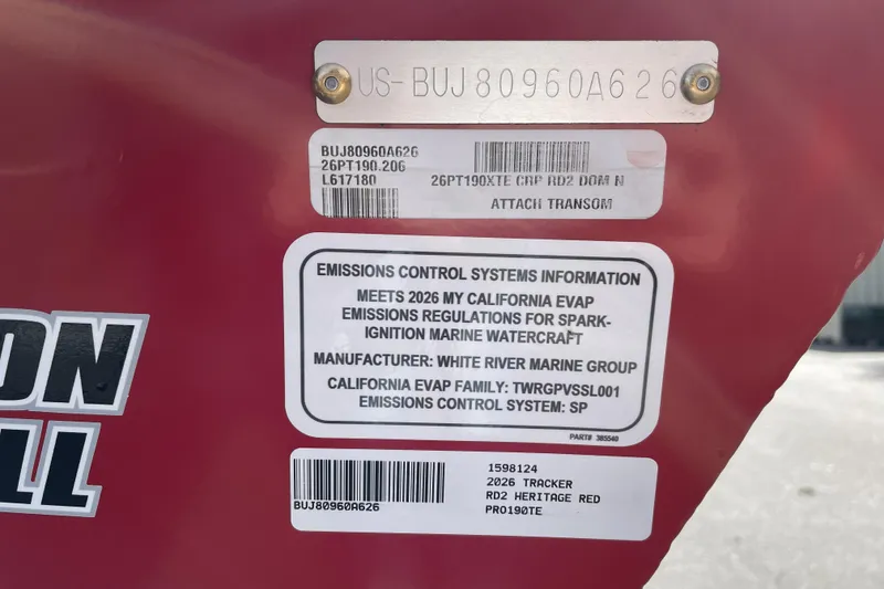 Slide: The Image of 2026 Tracker Pro Team 190 emissions control label on red surface, detailing compliance information. - 73