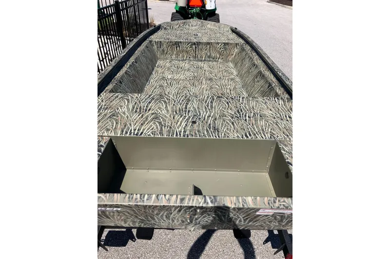 Slide: The Image of 2026 Tracker Grizzly 1648 Utility boat with camouflage interior design. - 4