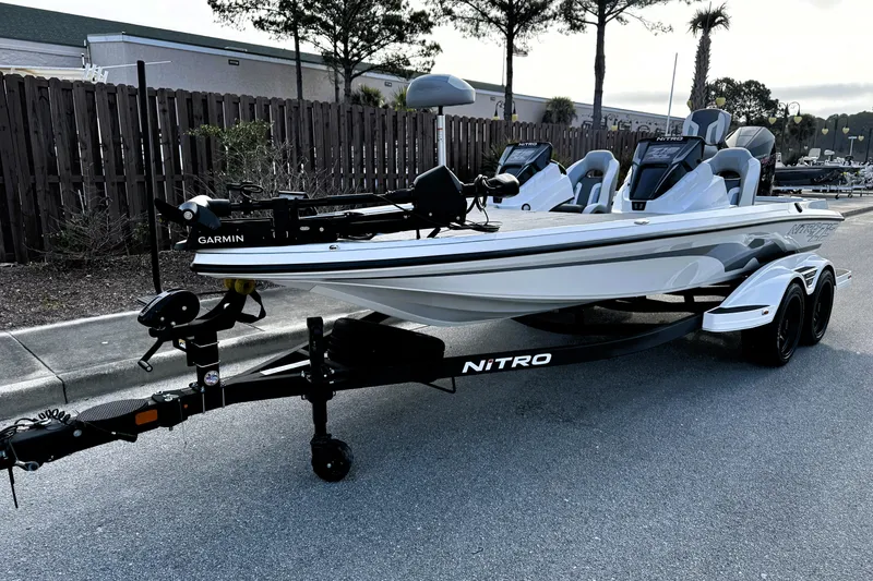 The Image of 2026 Nitro Z19 XL Pro boat on trailer, featuring Garmin equipment, parked outdoors. - 0