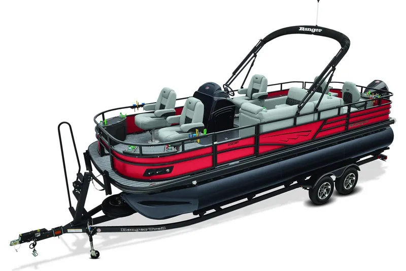 Slide: The Image of 2026 Ranger 223F pontoon boat on trailer, parked in scenic countryside. - 1