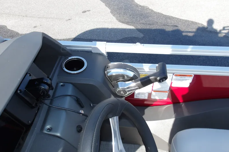 Slide: The Image of Control panel of 2026 Sun Tracker SportFish 22 DLX boat with steering wheel and throttle. - 20