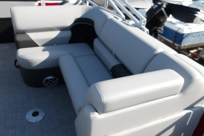 Slide: The Image of Luxurious seating on 2026 Sun Tracker SportFish 22 DLX pontoon boat, featuring sleek design. - 22