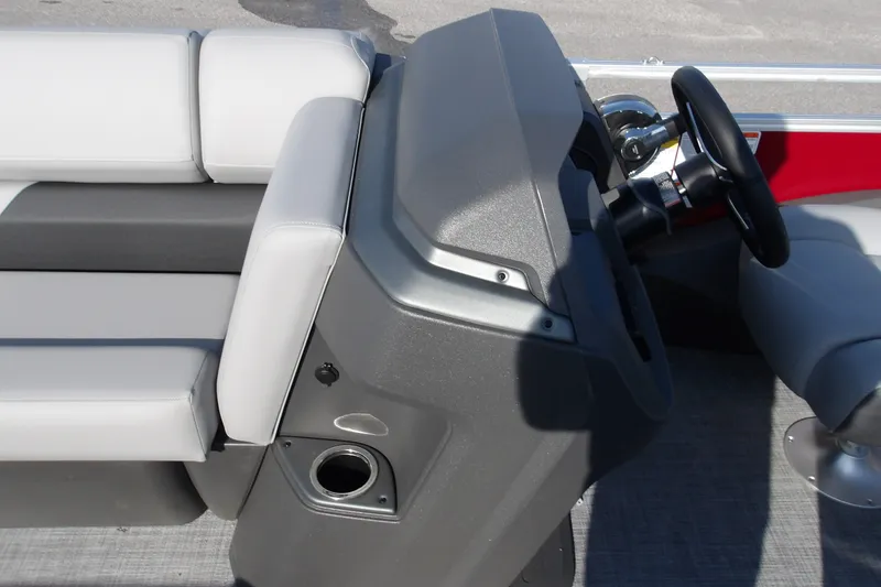 Slide: The Image of 2026 Sun Tracker SportFish 22 DLX boat interior with steering console and seating. - 18