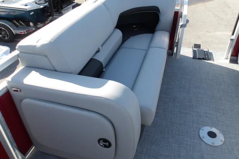 Slide: The Image of 2026 Sun Tracker SportFish 22 DLX boat interior with gray seating and flooring. - 16