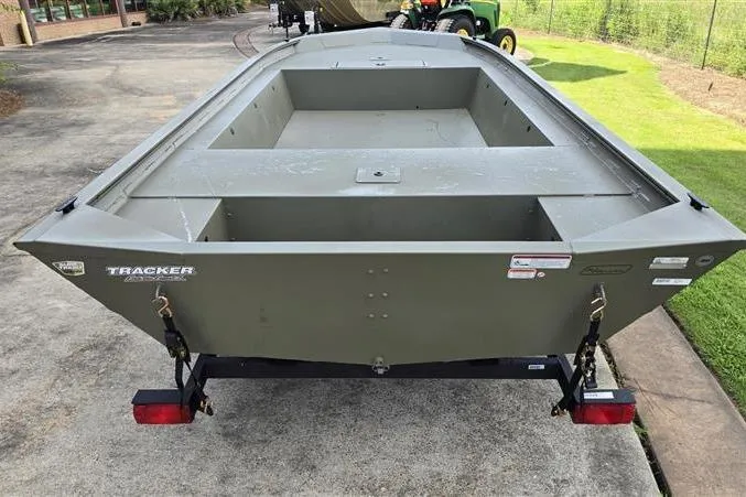 Slide: The Image of 2026 Tracker Grizzly 1754 Utility boat on trailer, parked outdoors. - 7