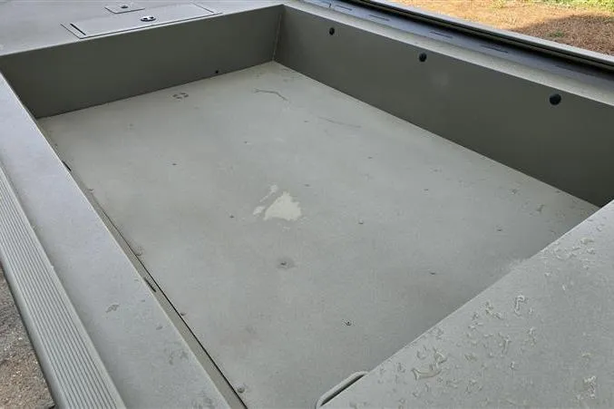 Slide: The Image of 2026 Tracker Grizzly 1754 Utility boat interior, showcasing spacious, durable design. - 26