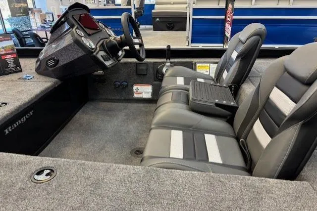 Slide: The Image of 2026 Ranger RT178C boat interior with steering console and cushioned seating. - 5