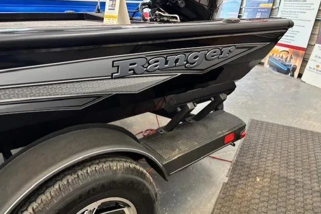 Slide: The Image of 2026 Ranger RT178C boat on trailer, showcasing sleek black design and branding. - 6