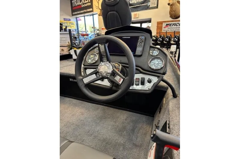 Slide: The Image of 2026 Ranger RT178C boat dashboard with steering wheel and gauges in showroom. - 7