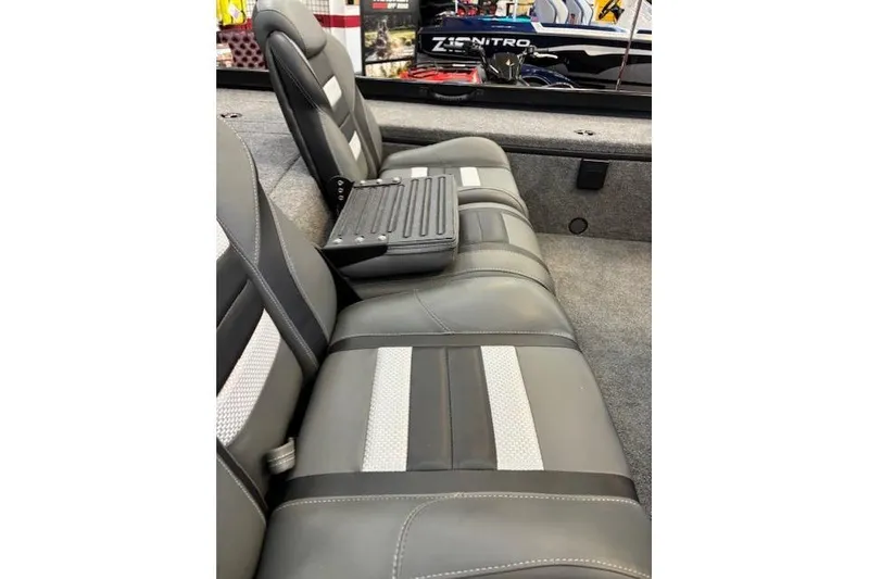 Slide: The Image of 2026 Ranger RT178C boat interior with gray and white seating, featuring a foldable armrest. - 8