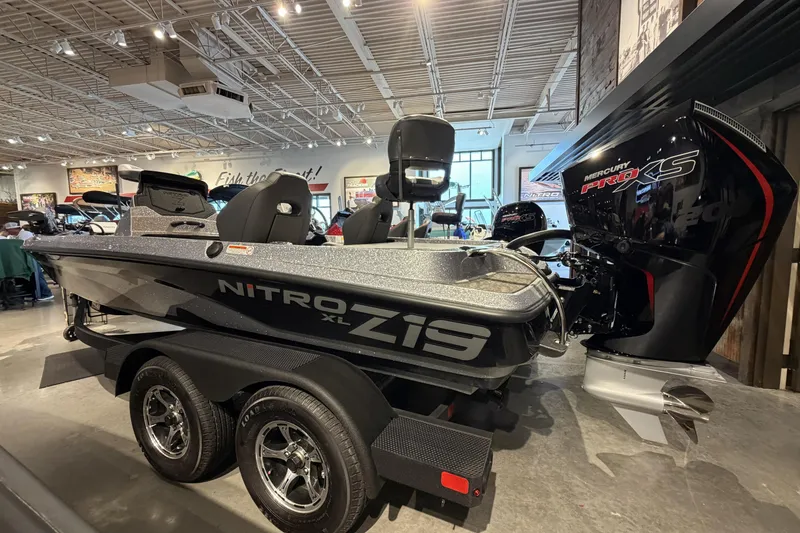 The Image of 2026 Nitro Z19 XL Pro boat displayed indoors with Mercury Pro XS engine. - 0
