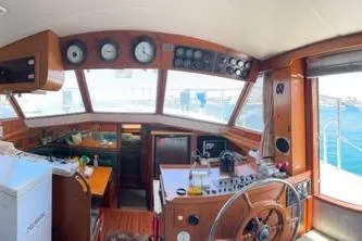 Slide: The Image of Interior of 1987 Symbol 51 Classic yacht with wooden dashboard and nautical instruments. - 3