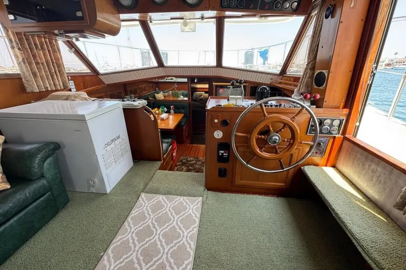 Slide: The Image of 1987 Symbol 51 Classic yacht interior with helm, seating, and freezer. - 4