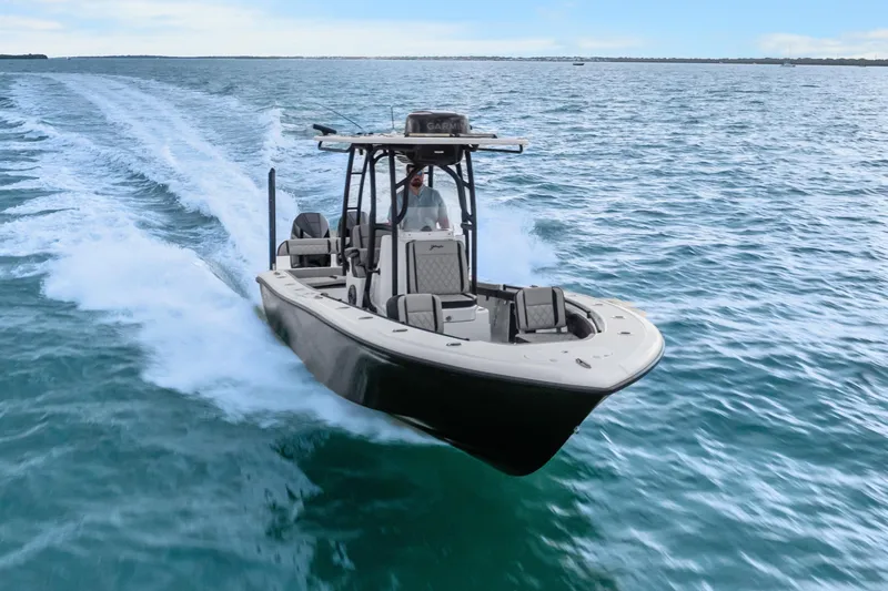 Slide: The Image of 2025 Yellowfin 26 Hybrid boat cruising on open water, showcasing sleek design and performance. - 10