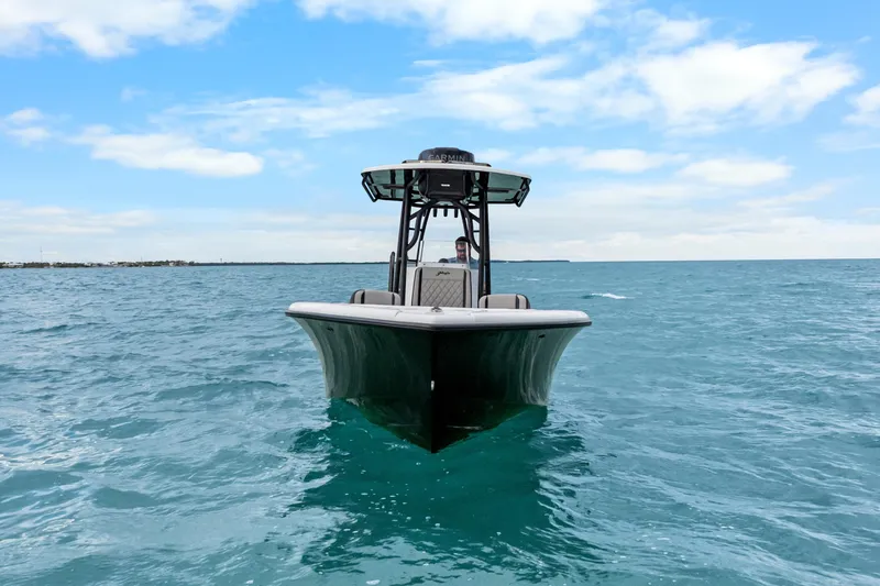 Slide: The Image of 2025 Yellowfin 26 Hybrid boat on open sea under blue sky. - 18