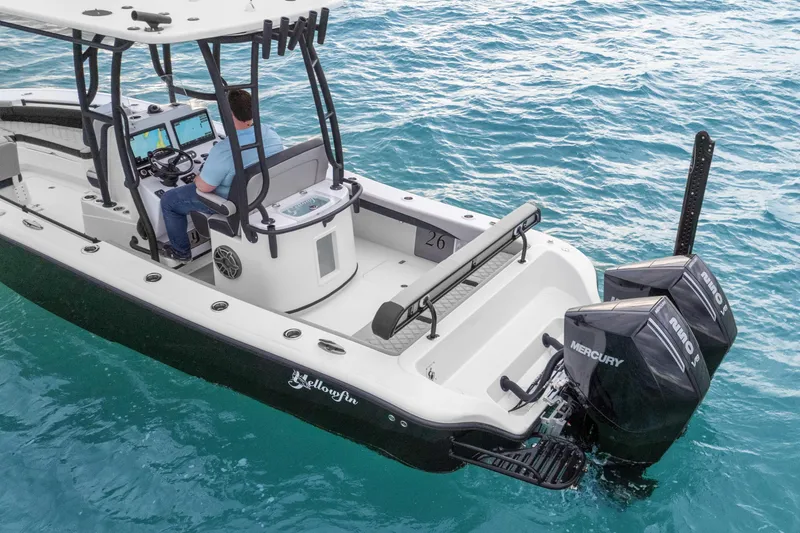 Slide: The Image of 2025 Yellowfin 26 Hybrid boat on blue water, featuring dual Mercury engines. - 20