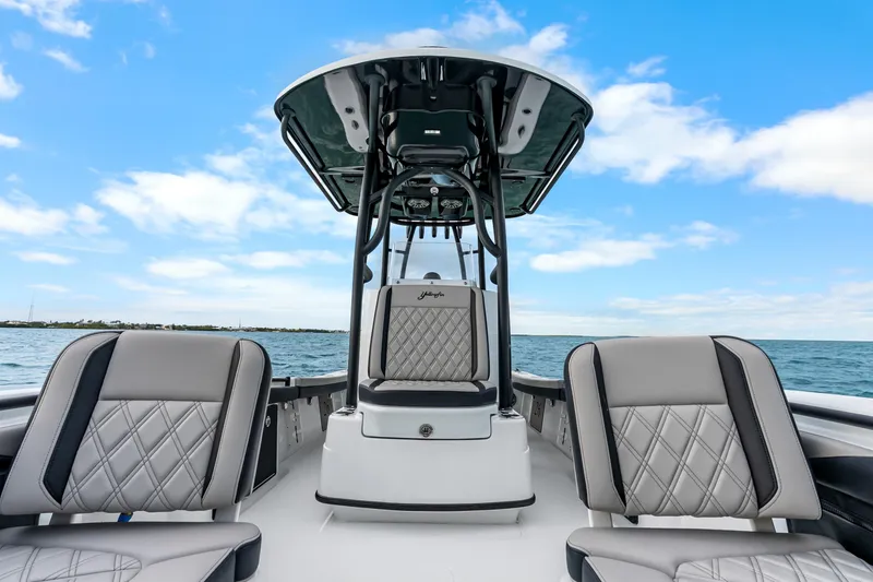 Slide: The Image of 2025 Yellowfin 26 Hybrid boat interior with luxurious seating on open water. - 25