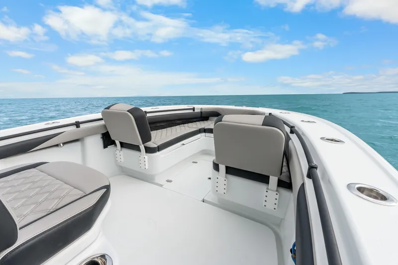 Slide: The Image of 2025 Yellowfin 26 Hybrid boat interior with ocean view, featuring sleek seating and modern design. - 28