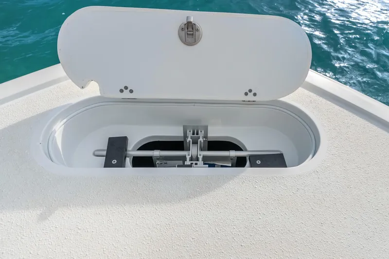 Slide: The Image of Open hatch on 2025 Yellowfin 26 Hybrid boat, revealing storage compartment. - 33