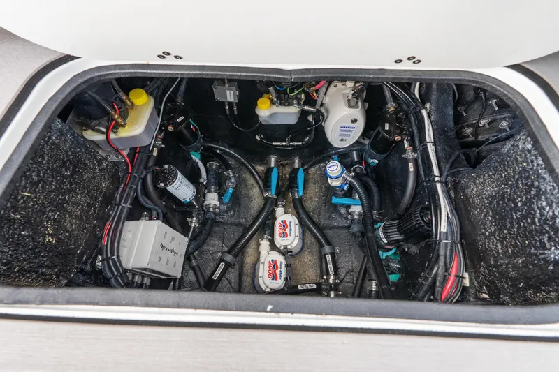 Slide: The Image of 2025 Yellowfin 26 Hybrid boat engine compartment with wiring and components. - 39