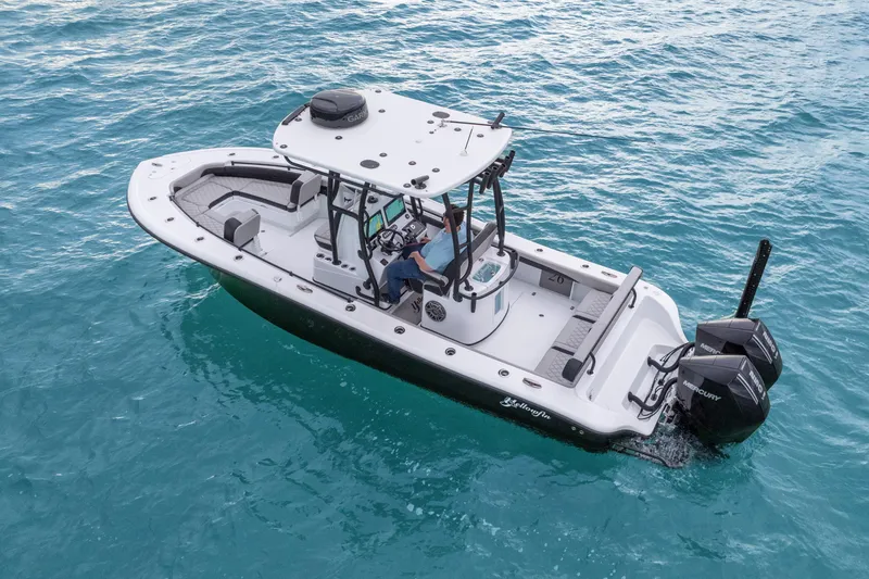 Slide: The Image of 2025 Yellowfin 26 Hybrid boat on clear blue water, featuring dual Mercury engines. - 4