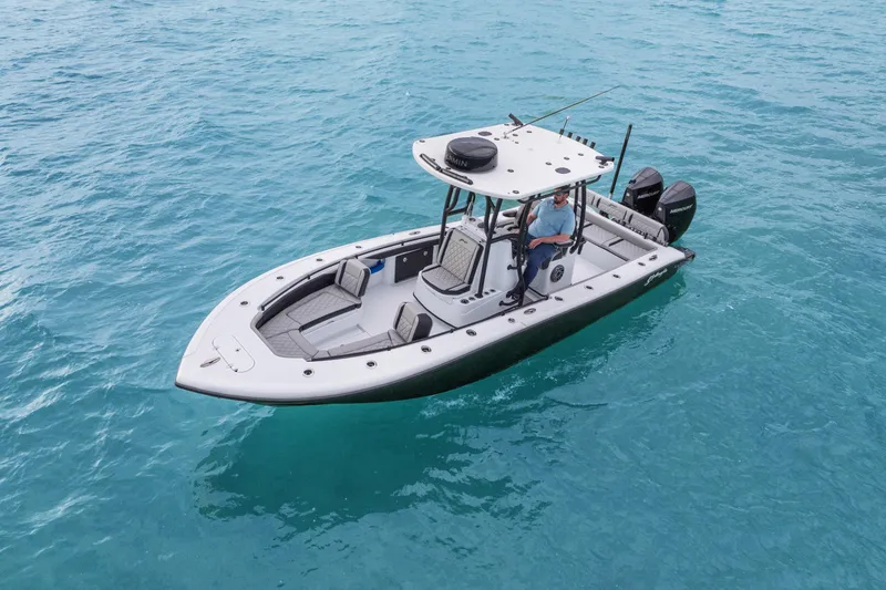 Slide: The Image of 2025 Yellowfin 26 Hybrid boat on clear blue water, featuring dual outboard engines. - 5