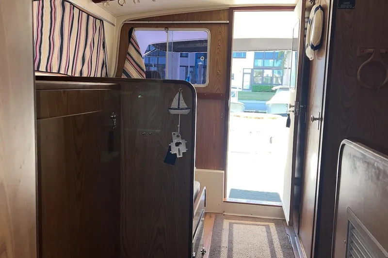 Slide: The Image of Cozy cabin interior of 1981 Bertram 33 Sport Fisherman with bedding. - 15