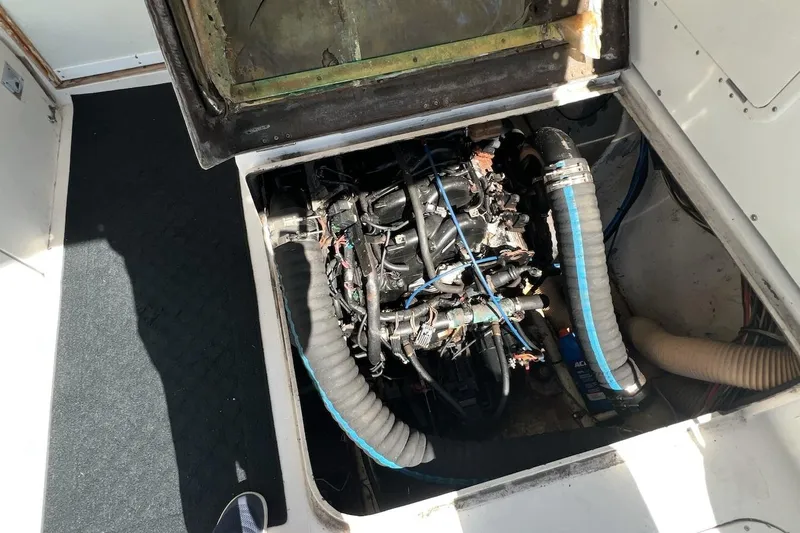 Slide: The Image of Engine compartment of a 1981 Bertram 33 Sport Fisherman boat, showing detailed machinery. - 17