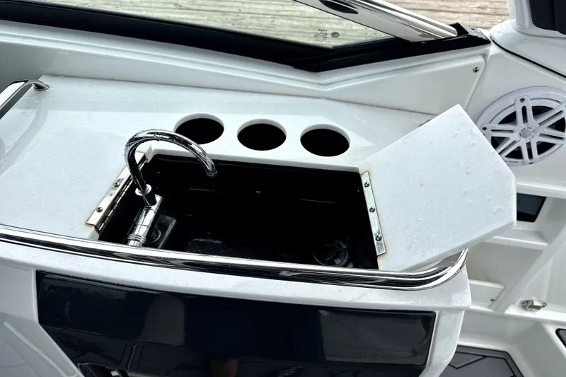 Slide: The Image of 2023 Monterey 305SS Super Sport boat interior with luxurious seating and scenic waterfront view. - 11