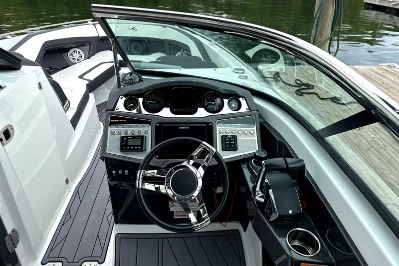 Slide: The Image of 2023 Monterey 305SS Super Sport boat interior with sleek design and modern amenities. - 18