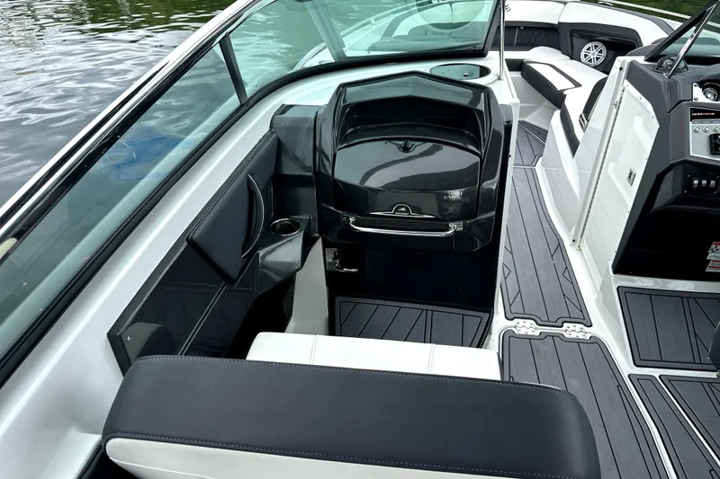Slide: The Image of Cockpit of 2023 Monterey 305SS Super Sport boat with modern controls and steering wheel. - 22