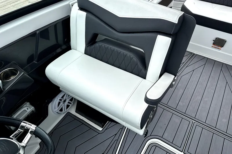 Slide: The Image of 2023 Monterey 305SS Super Sport boat controls and steering wheel close-up. - 24