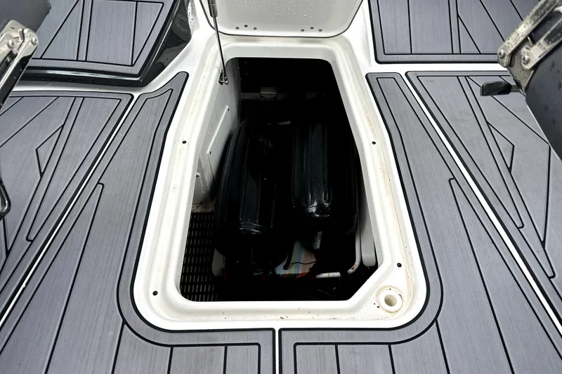 Slide: The Image of 2023 Monterey 305SS Super Sport boat dashboard with steering wheel and controls. - 25