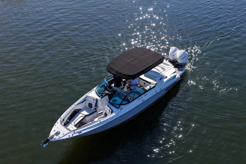 Slide: The Image of 2023 Monterey 305SS Super Sport boat cruising on sparkling water. - 37