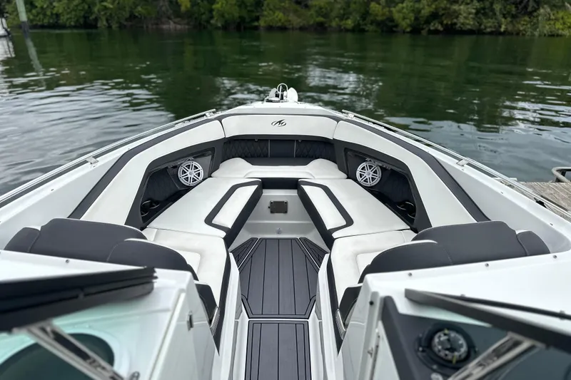 Slide: The Image of Twin Mercury outboard engines on a 2023 Monterey 305SS Super Sport boat. - 6