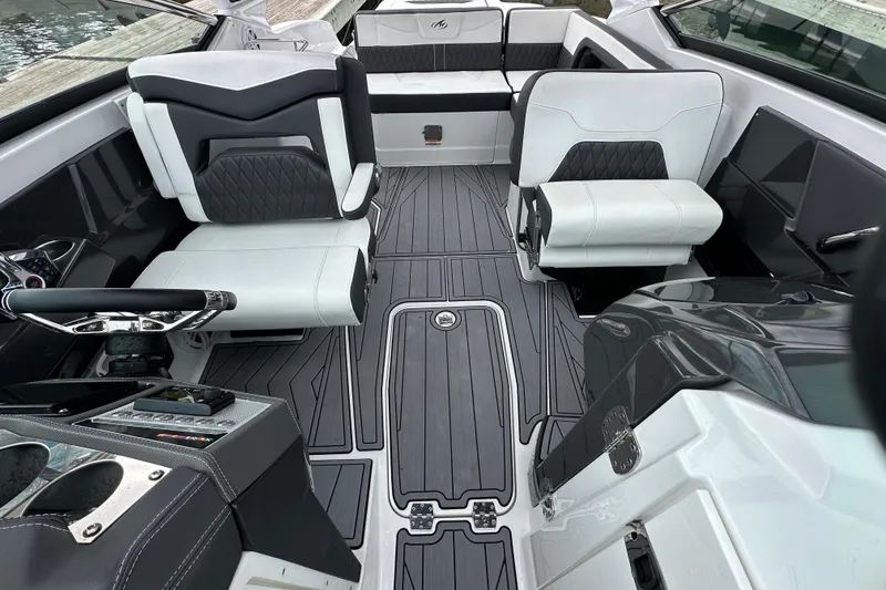 Slide: The Image of 2023 Monterey 305SS Super Sport boat with dual outboard engines on water. - 8