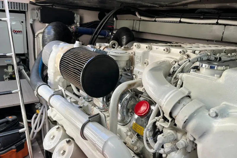 Slide: The Image of Engine room of a 2003 Sea Ray 550 Sundancer yacht, showcasing mechanical components. - 11
