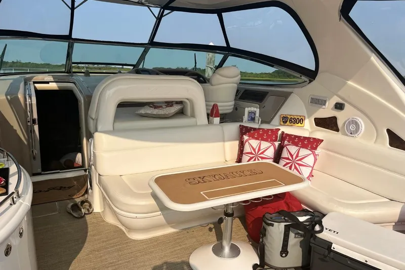 Slide: The Image of Luxurious interior of 2003 Sea Ray 550 Sundancer yacht with plush seating and nautical decor. - 2