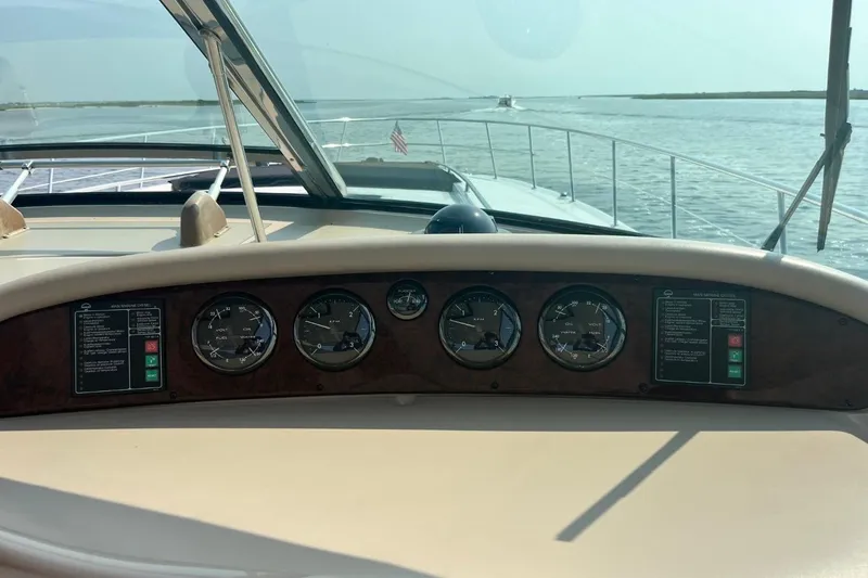 Slide: The Image of Dashboard view of a 2003 Sea Ray 550 Sundancer yacht on open water. - 7
