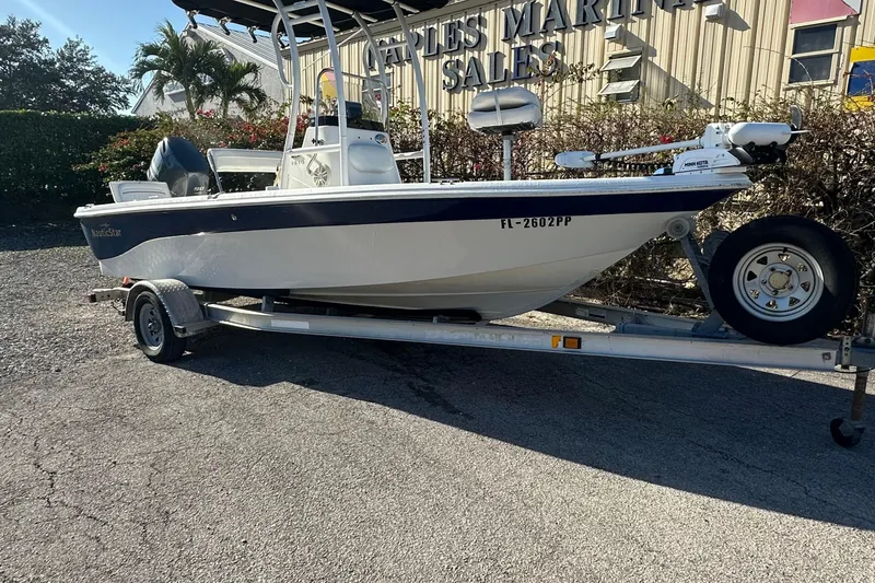 Slide: The Image of 2014 Nautistar 1810 CC boat on trailer outside sales building. - 10