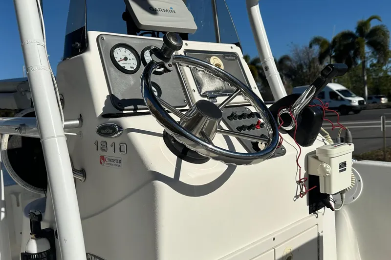 Slide: The Image of 2014 Nautistar 1810 CC boat console with steering wheel and controls. - 7