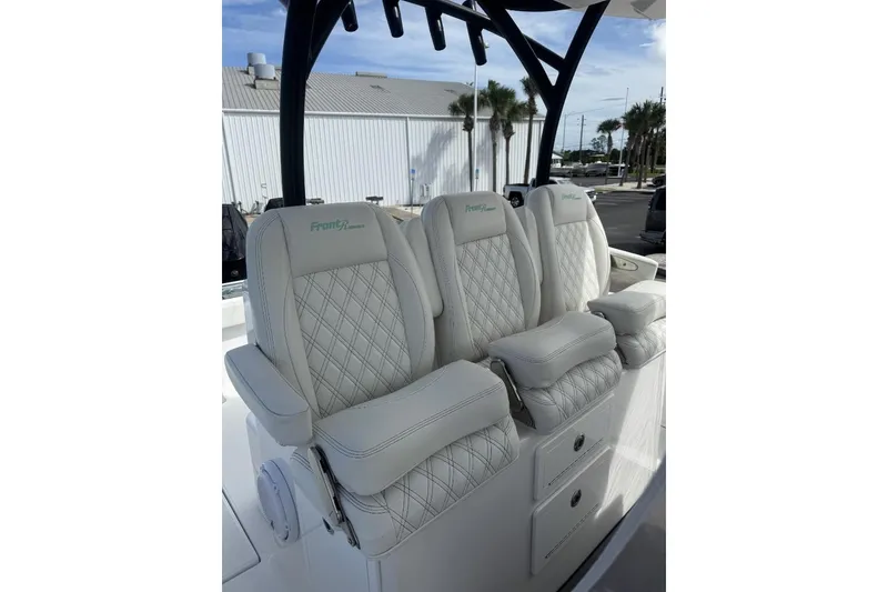 Slide: The Image of 2024 Front Runner 36 Center Console boat with luxurious white seating. - 4