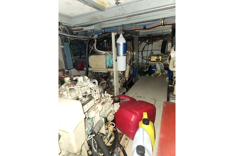 Slide: The Image of Engine room of 1976 Hatterus 42 Long Range Cruiser with visible machinery and equipment. - 18