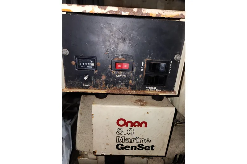Slide: The Image of Onan 8.0 Marine GenSet control panel on 1976 Hatterus 42 Long Range Cruiser. - 19