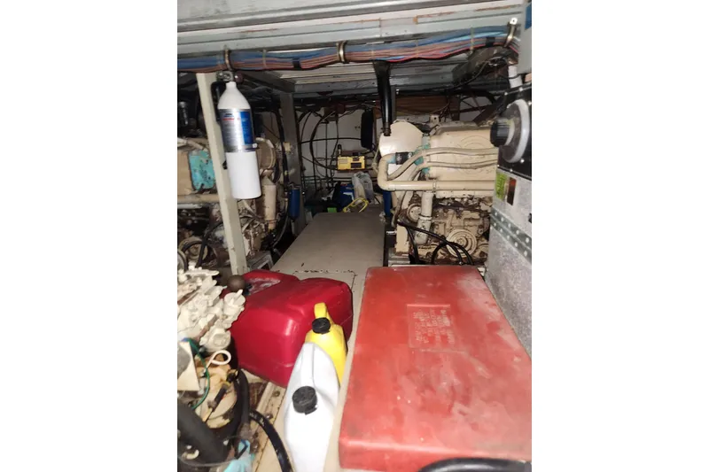 Slide: The Image of Engine room of 1976 Hatterus 42 Long Range Cruiser with equipment and storage containers. - 21