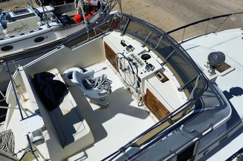 Slide: The Image of 1976 Hatterus 42 Long Range Cruiser cockpit with steering wheel and seating area. - 4