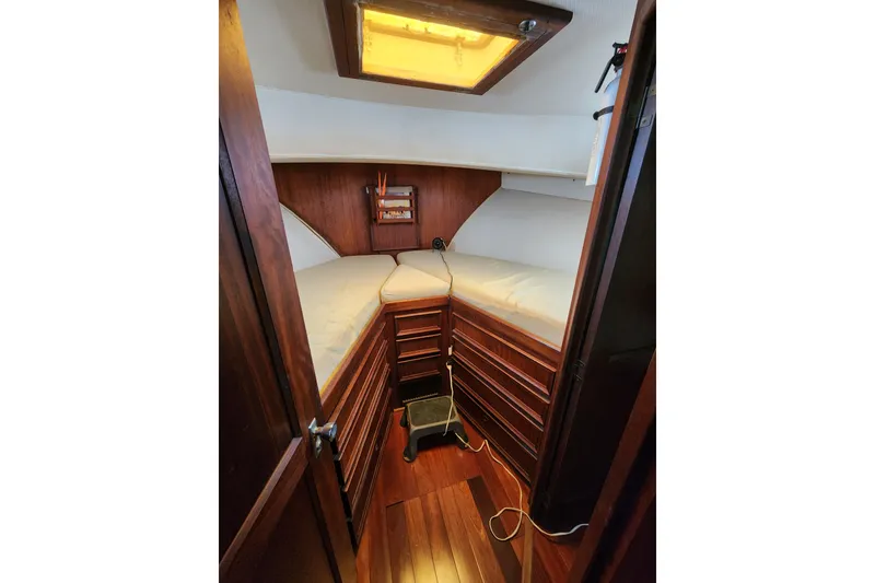Slide: The Image of Cozy cabin interior of 1976 Hatterus 42 Long Range Cruiser with wooden furnishings. - 7