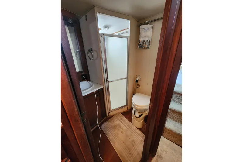 Slide: The Image of Bathroom interior of 1976 Hatterus 42 Long Range Cruiser with shower and toilet. - 8
